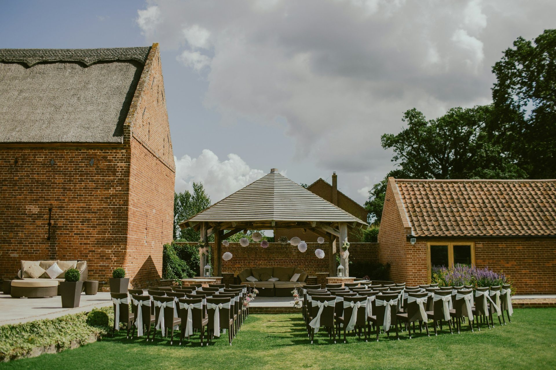 outdoor with buildings and chairs setup for a wedding